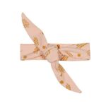 Lief en schattig roze knoophaarbandje gemaakt van katoen uit de collectie Magic Forest van Frogs and Dogs met een print in okergeel.