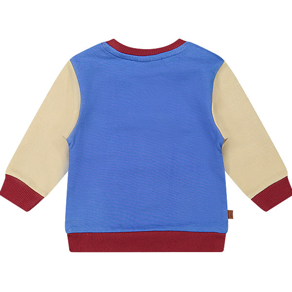 Dit stoere sweater in de kleur blauw, rood & beige komt uit de collectie Handsome Academy van Frogs and Dogs. De sweater heeft op de voorkant groot in het blauw de tekst staan 'Champion'. De letters zijn geborduurd op de sweater en links onderin is het logo van de collectie.