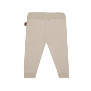 Dit mooie fijn gebreide beige broekje komt uit de collectie Paloma van Frogs en Dogs. Het broekje is effen van kleur en heeft een elastische tailleband en boordjes aan de pijpjes.