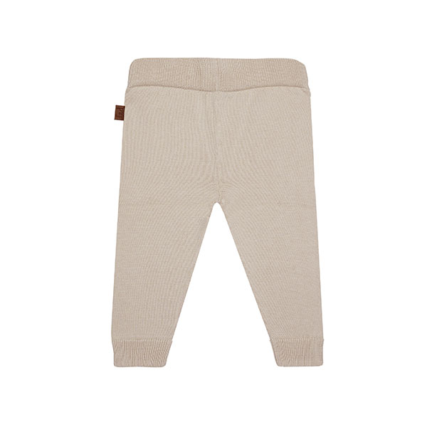 Dit mooie fijn gebreide beige broekje komt uit de collectie Paloma van Frogs en Dogs. Het broekje is effen van kleur en heeft een elastische tailleband en boordjes aan de pijpjes.