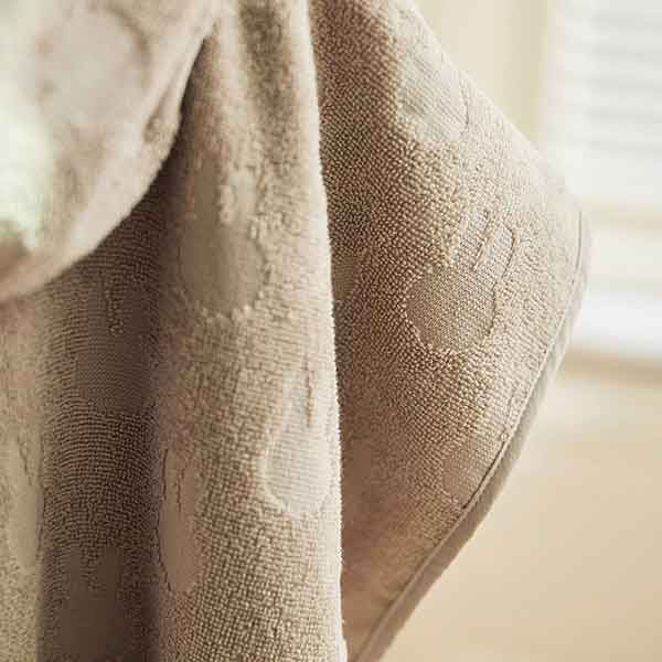 Jollein Nijntje badponcho Terry in de kleur nougat met capuchon en subtiele Nijntje print