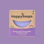 Paarse HappySoaps Lavender Bliss Conditioner Bar naast kartonnen verpakking