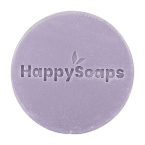 Paarse HappySoaps Lavender Bliss Conditioner Bar naast kartonnen verpakking