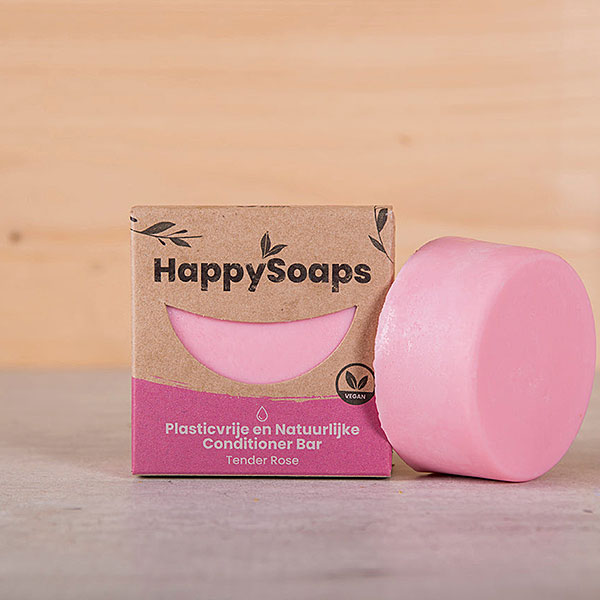 Roze HappySoaps Tender Rose Conditioner Bar naast de verpakking