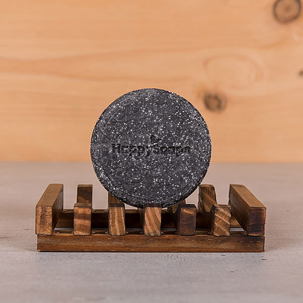 HappySoaps Shampoo Bar Charming Charcoal in kartonnen verpakking met houtskoolkleurige bar zichtbaar aan de voorkant