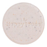 Witte HappySoaps Totally Coco Nuts Shampoo Bar met subtiele stukjes kokos en clean background