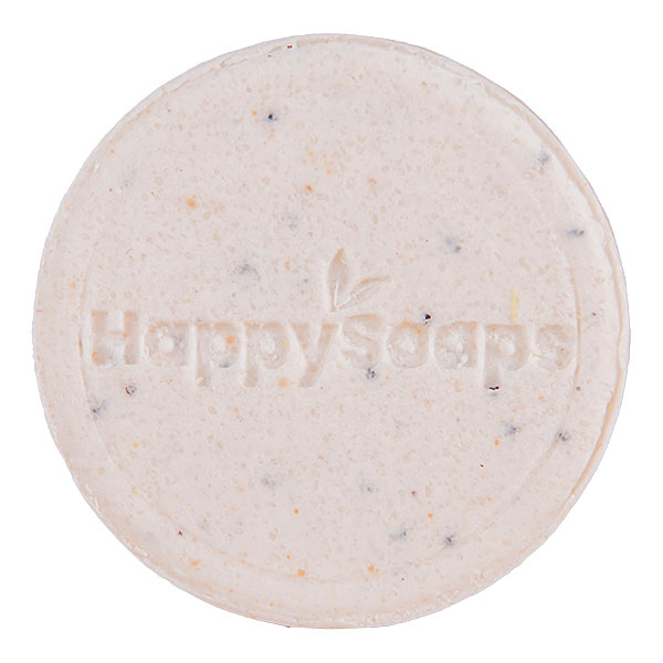 Witte HappySoaps Totally Coco Nuts Shampoo Bar met subtiele stukjes kokos en clean background