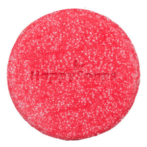 Happysoaps You’re One in a Melon Shampoo Bar in roze kleur met verpakking op roze achtergrond.