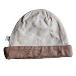 Tweedehands babymutsje Studio Spruitje poederroze met beige omslagrand