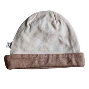 Tweedehands babymutsje Studio Spruitje poederroze met beige omslagrand