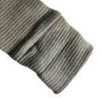 Groen baby shirtje voor jongens van Studio Spruitje met lange mouwen en houten knoopjes