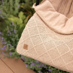 voetenzak groep 0 check knit biscuit voor autostoel baby